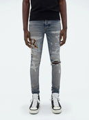 Amiri Leather Staggered Logo Jeans in Blue